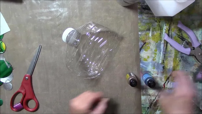 Add color to the water bottle top using alcohol inks (optional).