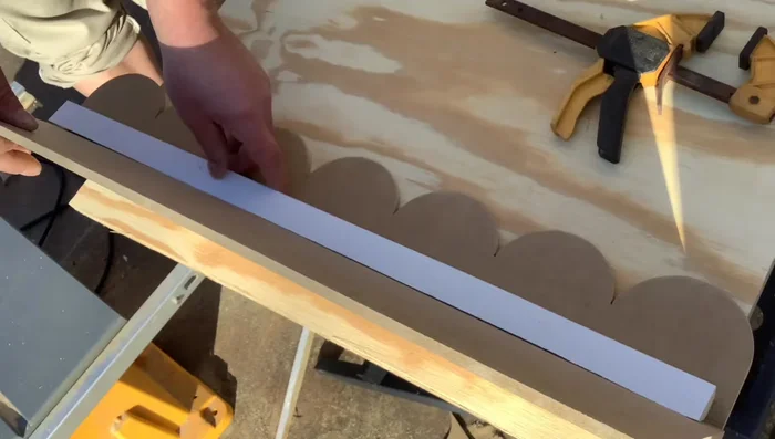 Apply glue along the molding line and attach it. Reinforce with nails.