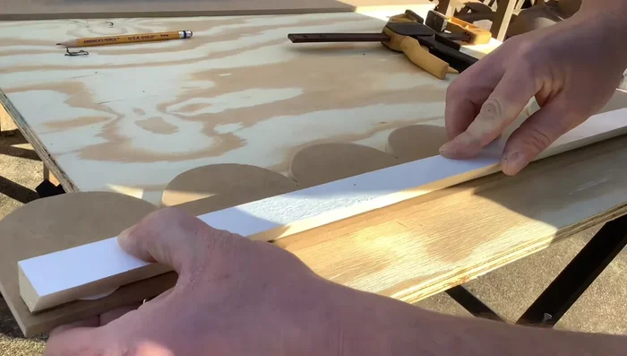 Apply glue along the molding line and attach it. Reinforce with nails.