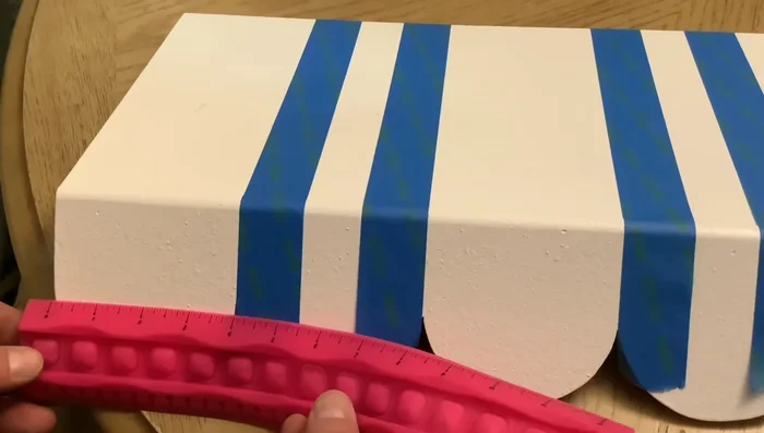 Use painter's tape to mark stripes and paint them black.