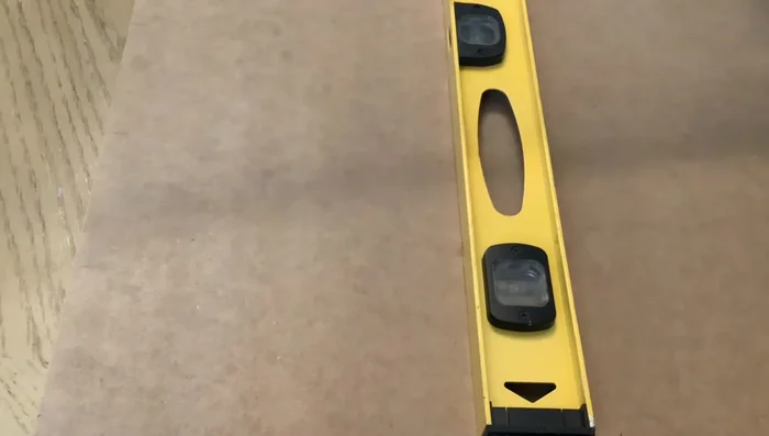 Cut the MDF into pieces. The largest piece is 9 inches wide, another is 4 inches wide for the scalloped edge, and two 2-inch wide pieces for support.