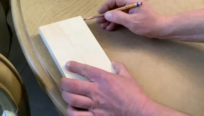 Create the scalloped edge on the 4-inch wide piece by tracing a glass or dish and cutting it out with a jig saw.