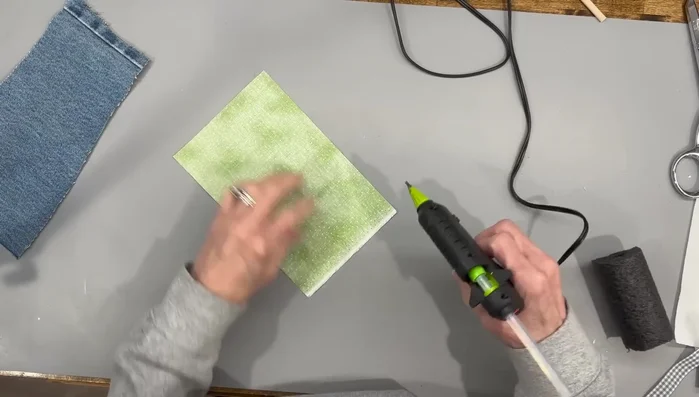 Cut slits in the fabric, glue to the pipe insulation on both ends, and attach felt circles.