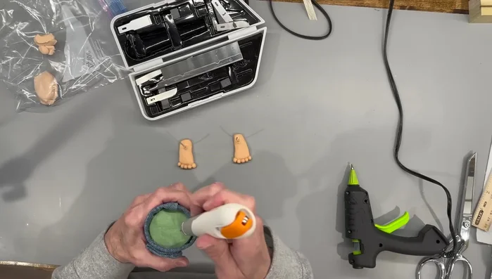 Add weights to the bottom of the gnome, cover with clay, and bake for 20 minutes at 275 degrees.