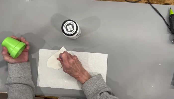 Paint the flower pot lime green and add white dots.