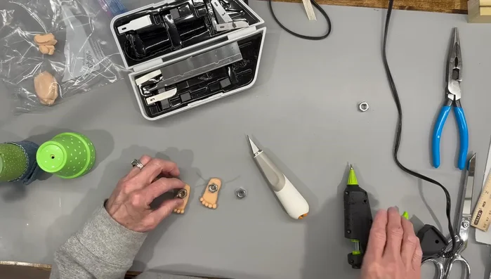 Add weights to the bottom of the gnome, cover with clay, and bake for 20 minutes at 275 degrees.