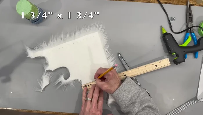 Cut the faux fur beard and glue it to the gnome's head.