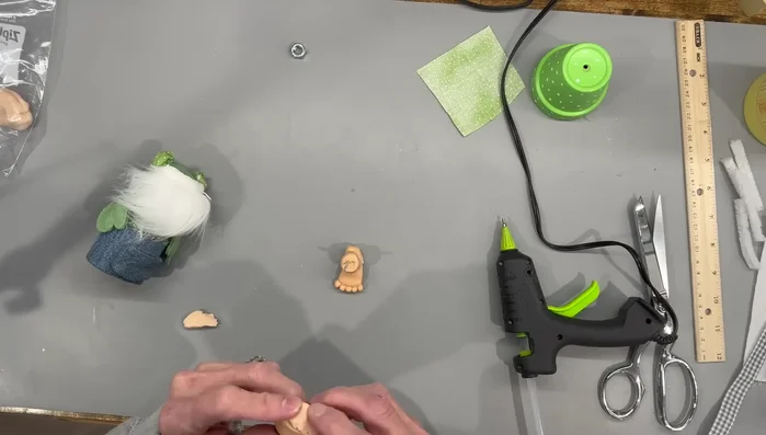 Add a pea-sized piece of clay to the bottom of the feet for balance, smooth, and bake for 15 minutes at 275 degrees.