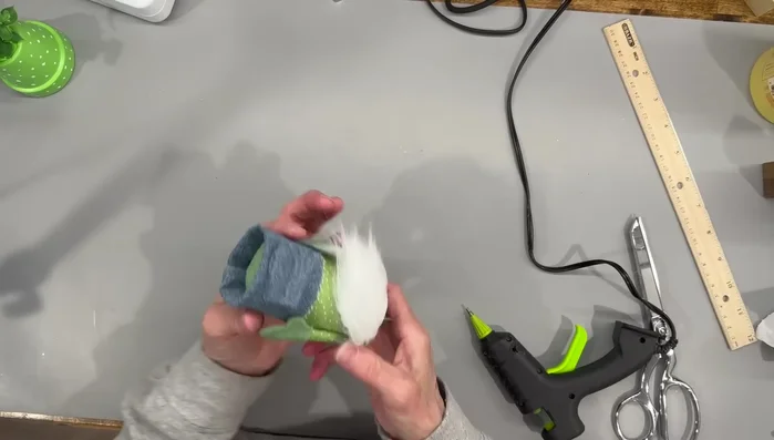 Attach the hat and nose.