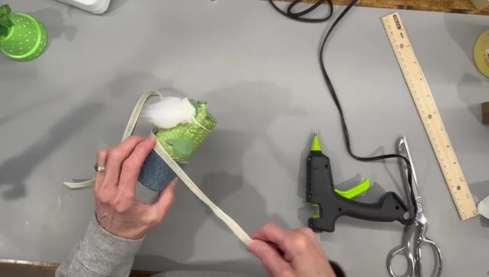 Attach the hat and nose.