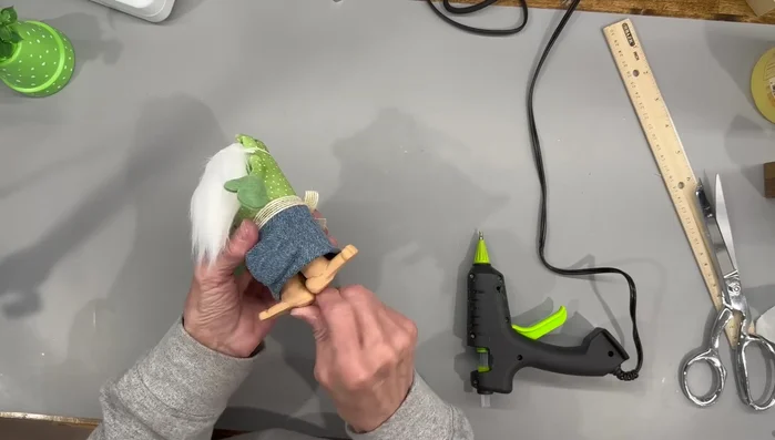 Attach the hat and nose.