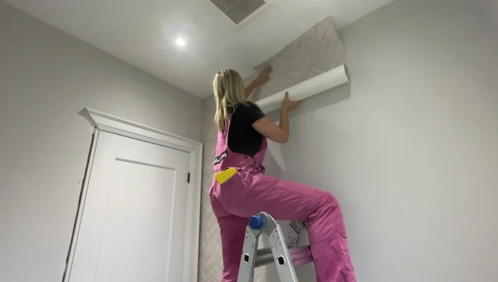 Hang subsequent panels: Apply paste to the wall, hang the next panel, ensuring a butt joint (or overlapping seam as per instructions). Smooth out air bubbles and leave a 1-2 inch overlap on the ceiling and baseboard.