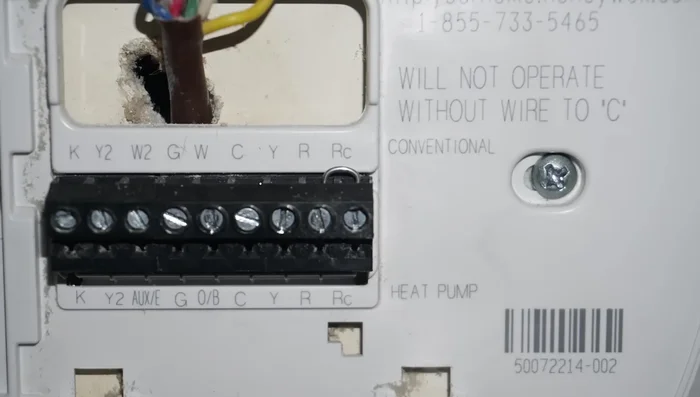 Connect the wires to the thermostat base terminals (R, Y, G, W, C) matching the wire colors. Ensure the 'C' (common) wire is connected; otherwise, the thermostat may not work.