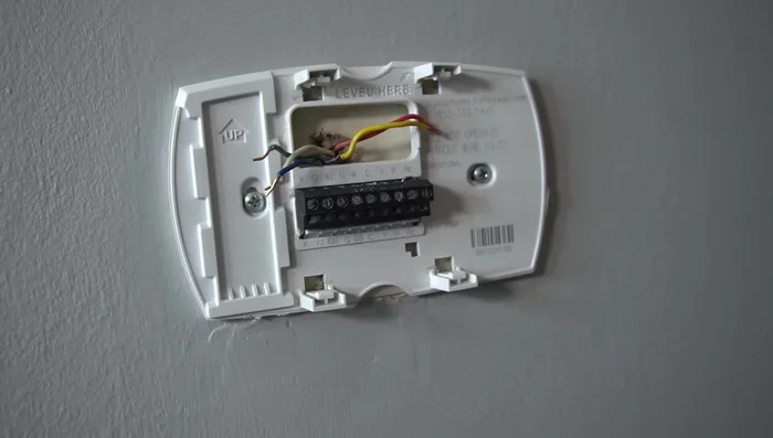 Spread the wires out to prevent them from falling back into the wall.