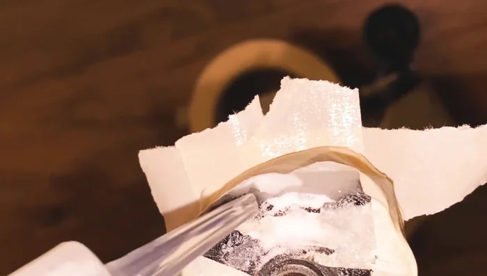 Tap between layers to distribute baking soda before adding glue.