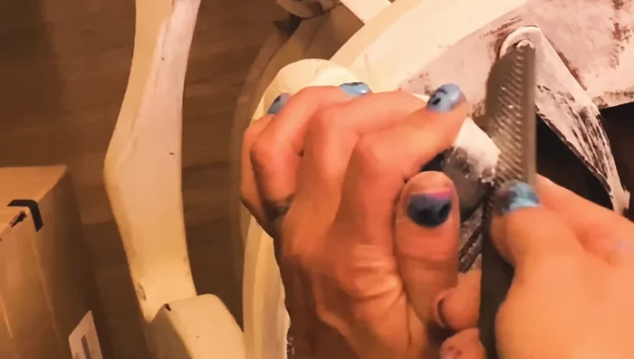 Use a metal file and nail file to refine the shape, removing excess material and smoothing the surface.