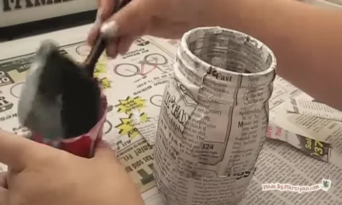 Add a sealing coat of Mod Podge over the newspaper, smoothing down any uneven areas. Set aside to dry.