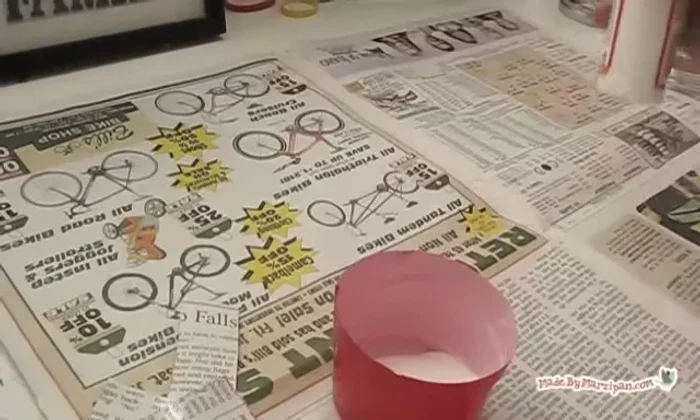 Add a sealing coat of Mod Podge over the newspaper, smoothing down any uneven areas. Set aside to dry.
