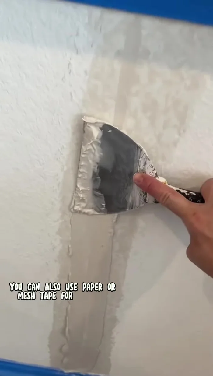 Reinforce with tape: Apply fiber fuse tape (or mesh tape) over the pre-filled crack for added strength and to prevent future cracking. This is a crucial step.