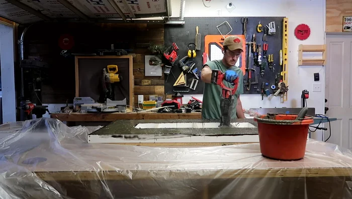 Cover the form with plastic and let the concrete cure for 24-48 hours.