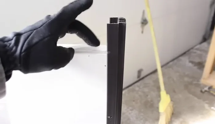 Cut the new door sweep to size using a hacksaw and miter box (optional). Alternatively, dry fit the sweep and mark the cut lines.