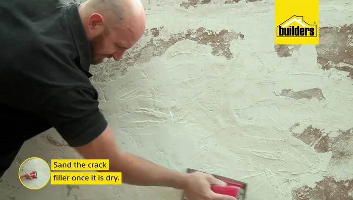 Sand the dry crack filler to a smooth finish.