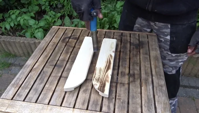 Sand, apply wood lacquer, and a thin layer of transparent spray.