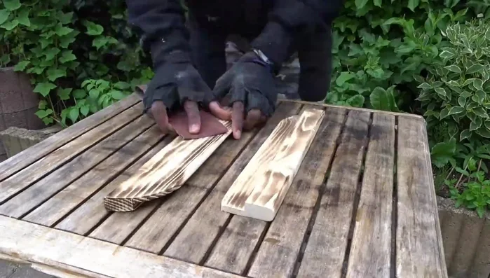 Sand, apply wood lacquer, and a thin layer of transparent spray.