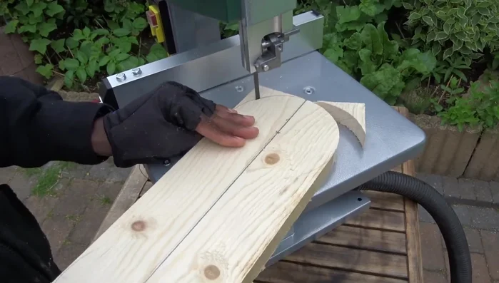 Use a bandsaw to cut along the traced lines to create the circle.