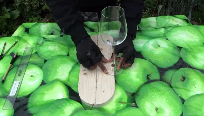 Transform the worktable into a router table and use a straight bit to create the cups.