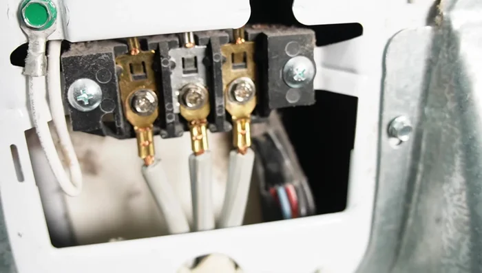 Inspect and test the electrical terminal block (visual inspection and multimeter voltage test).