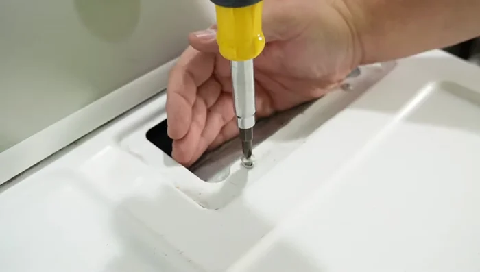 Access the front of the dryer and inspect the belt.