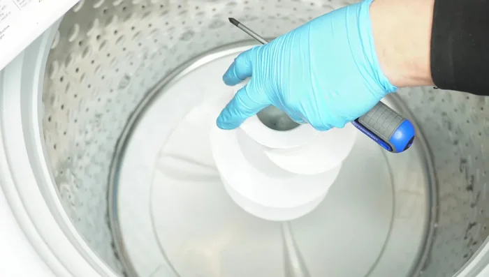 Inspect the central metal part of the tub and the nut for damage or looseness. Replace if necessary. (Requires specialized tools).