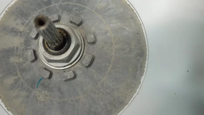 Inspect the central metal part of the tub and the nut for damage or looseness. Replace if necessary. (Requires specialized tools).