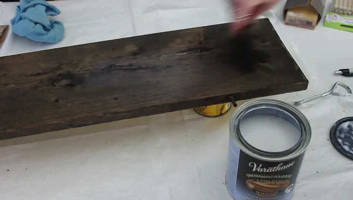 Apply multiple coats of clear coat to protect the shelf from water damage.