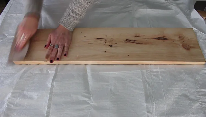 Apply a coat of wood stain to the board. Let it set and wipe off any excess.