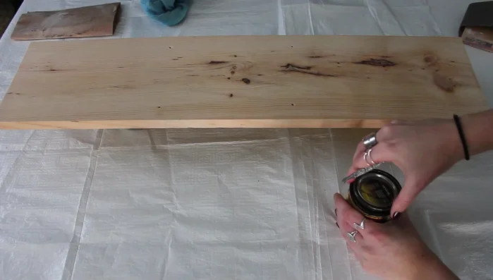 Apply a coat of wood stain to the board. Let it set and wipe off any excess.