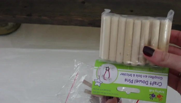 Drill holes for the wooden dowels to create hooks on the front of the board for hanging loofahs, etc.