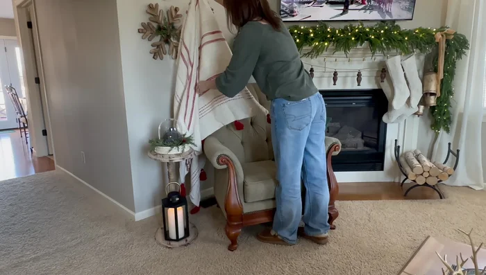 Add cozy pillows and throw blankets to the furniture.