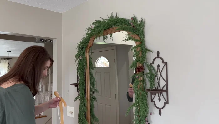 Add bows to garlands using velvet ribbon and green floral wire.