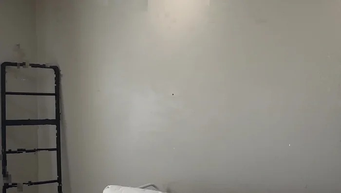 Hang wooden snowflakes above an armchair using picture hangers.