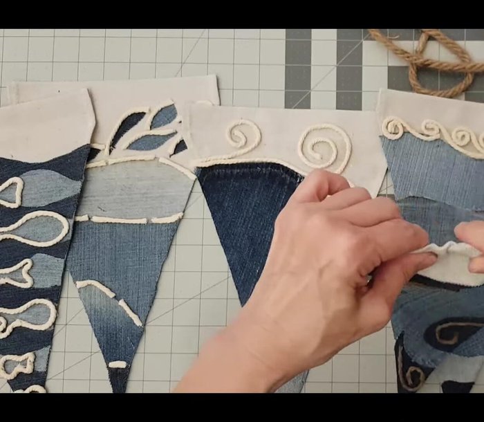 Tie lace ribbon and add starfish (optional) between pennants.