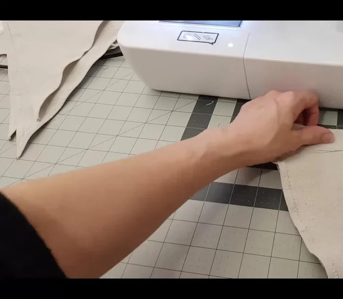Fold down the top rectangle, press, and sew a straight stitch along the bottom.