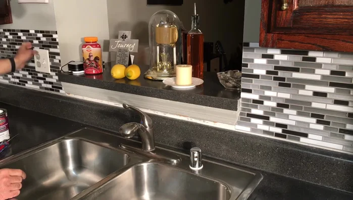 Install any additional trim pieces or corner pieces.