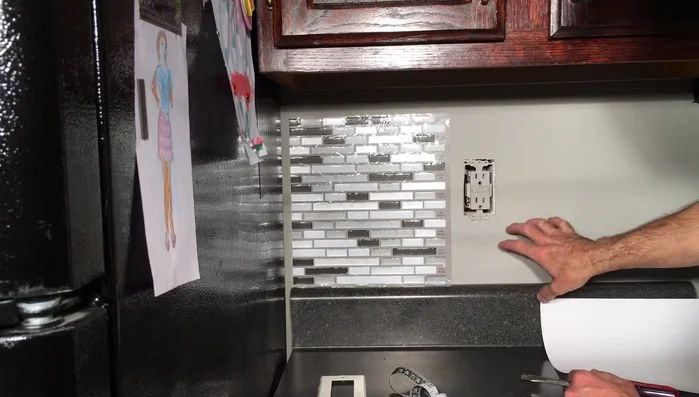 Repeat steps 6-8 for outlets, corners, and other areas requiring precise cuts. For outlets, it's easier to lay the tile and then cut down from the top, rather than attempting to cut a hole in advance.