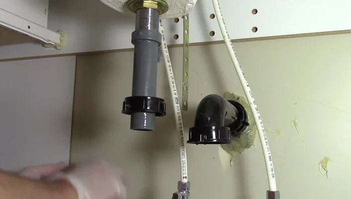 Clean the hole where the pivot rod goes with a paper towel.