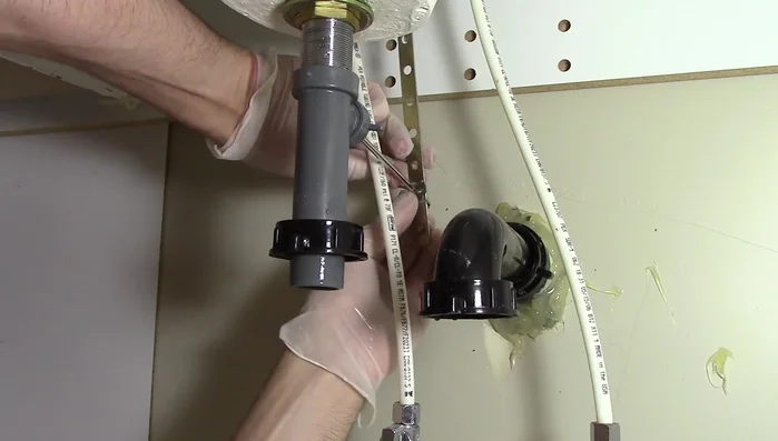 Reinstall the p-trap, ensuring the connections are tight.