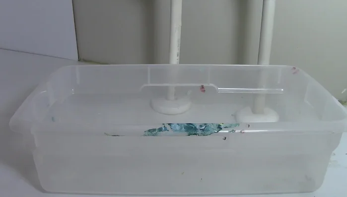 Place a bucket under the sink to catch water.