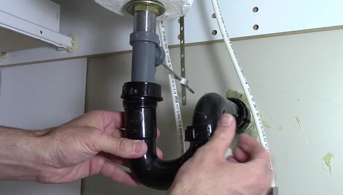 Pull out the pivot rod and pop-up stopper.