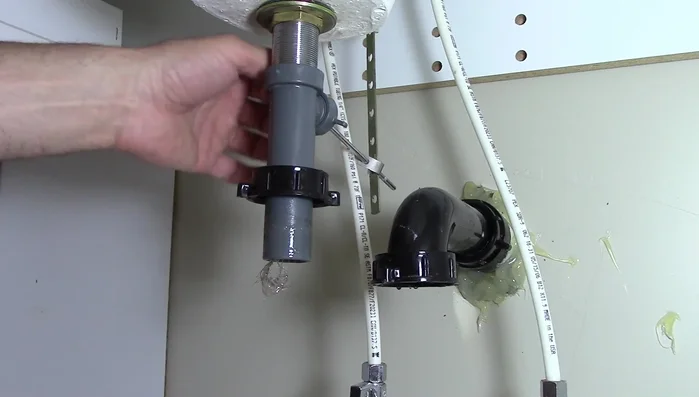 Pull out the pivot rod and pop-up stopper.